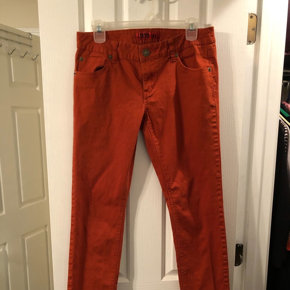 Rust color skinny jeans